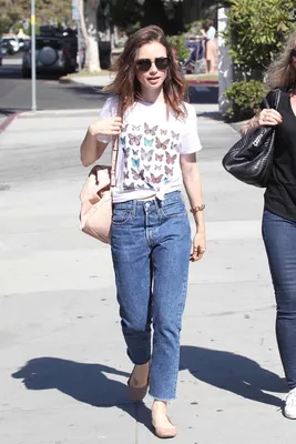 Lily Collins dressed in a striped shirt and white jeans while out in  Beverly Hills, Los