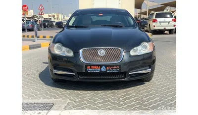 Jaguar XF 4.2 Super V8, model year 2008-, anthracite, driving, diagonal  from the front, frontal view, City Stock Photo - Alamy