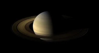 Темное изображение Сатурна и его колец - обои на рабочий стол