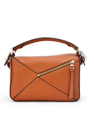 Buy Loewe small puzzle bag in classic calfskin at the Park Avenue boutique.  Loewe small puzzle bag in classic calfskin from the best world brands with  delivery across Ukraine › Park Avenue