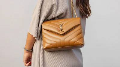 Black YSL-plaque grained-leather wristlet clutch bag | Saint Laurent |  MATCHES UK