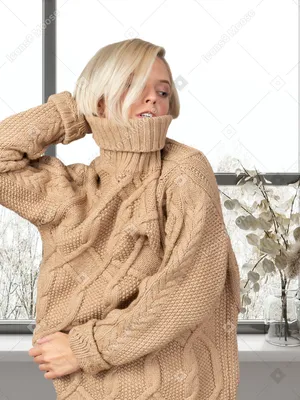 Красивая девушка в свитере позирует в студии Stock Photo | Adobe Stock
