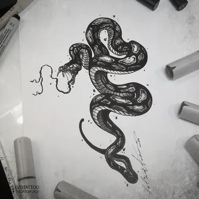 Тату змея на руке: значение и символика - tattopic.ru