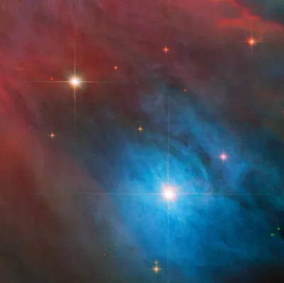Взгляните на две сияющие звезды в туманности Ориона, которые заснял Hubble